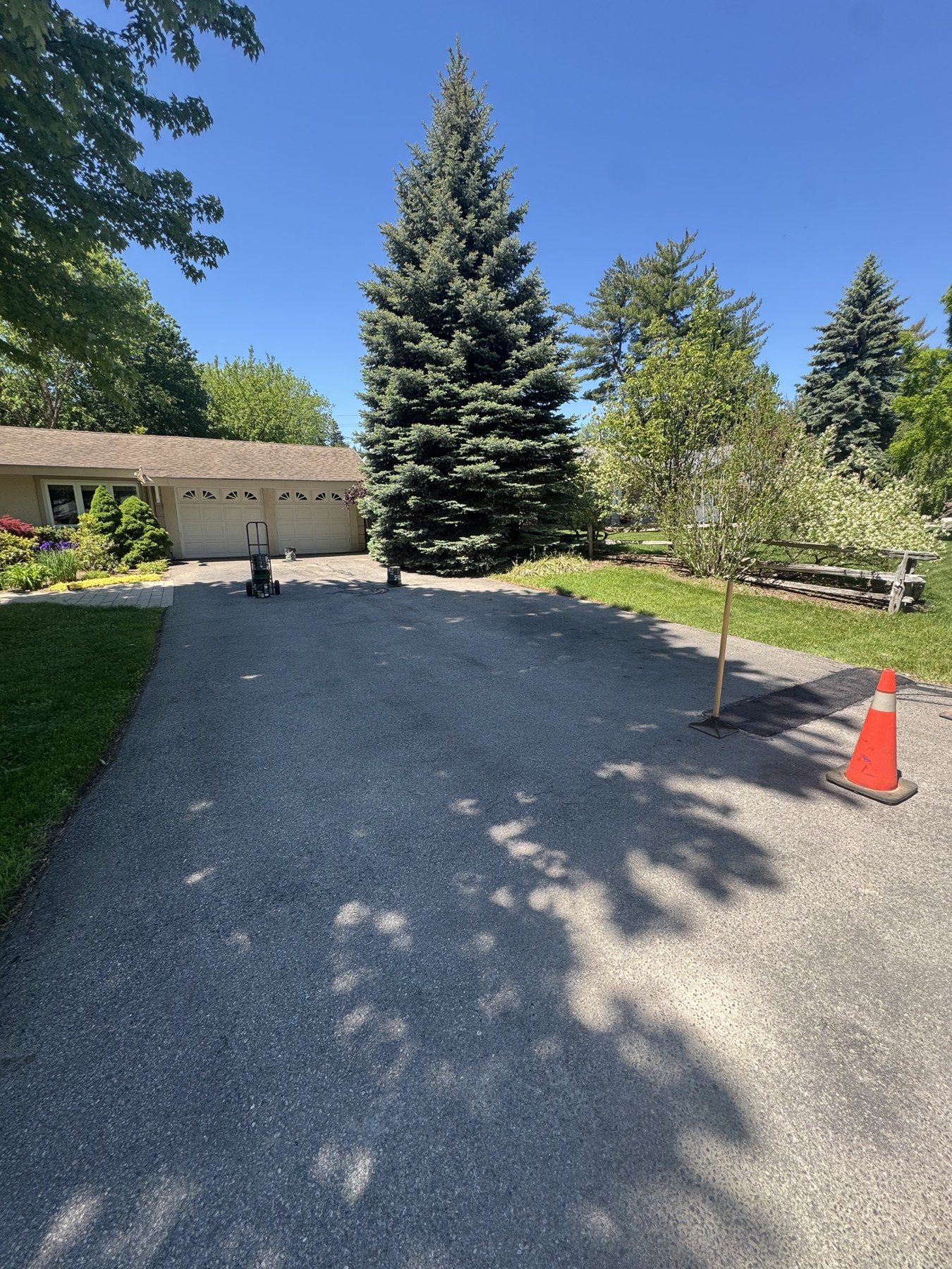 Faded asphalt driveway before sealing