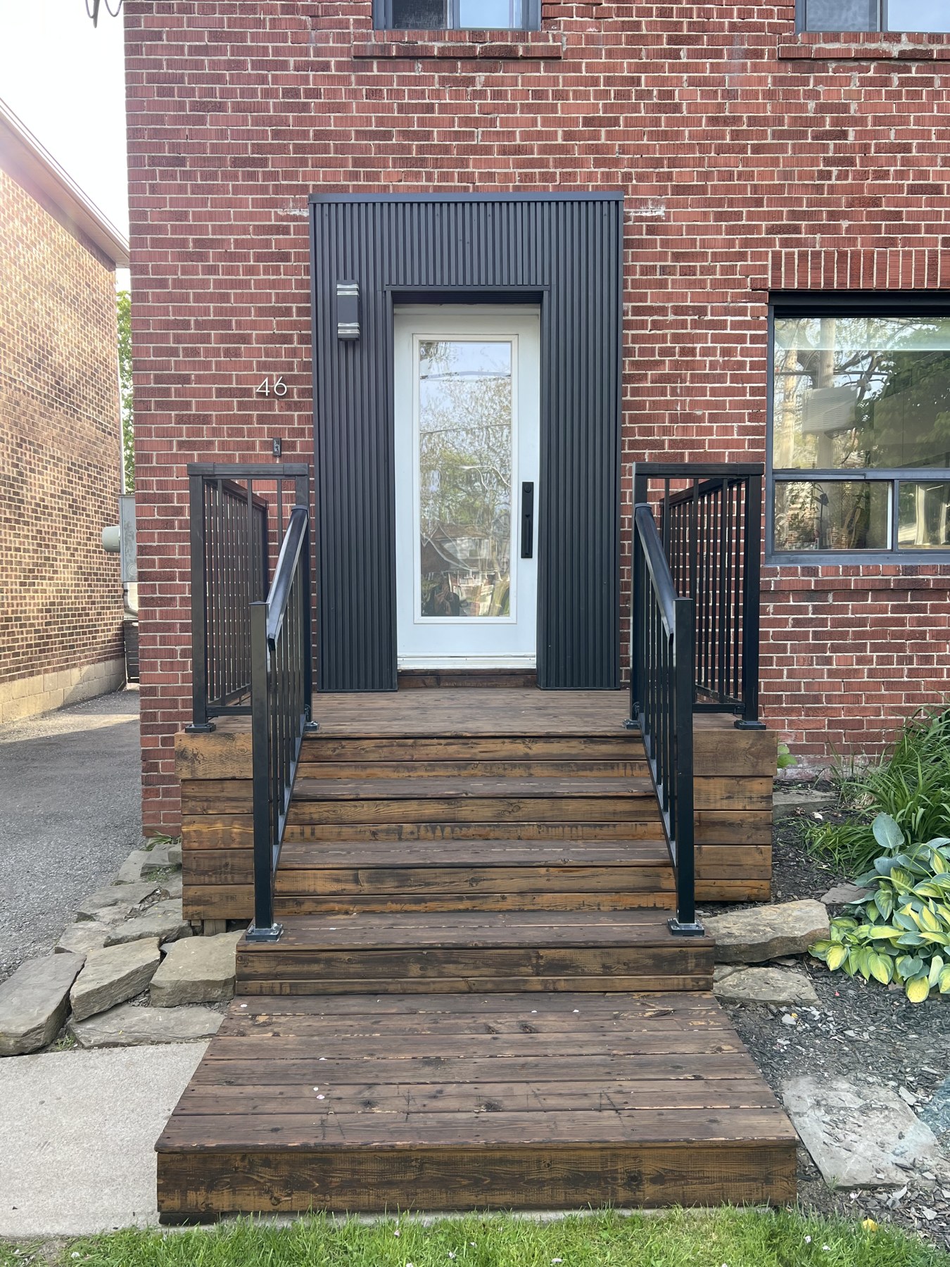 Front steps after stain and railing