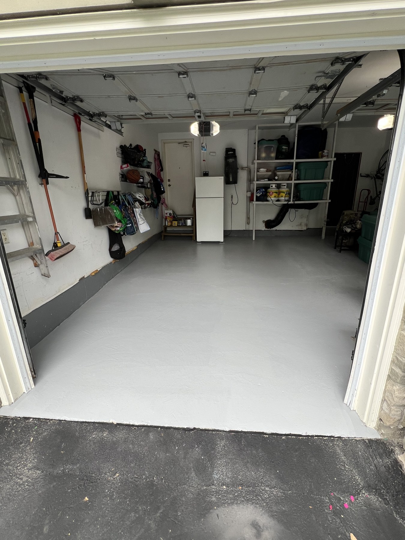 Finished garage floor coating viewed from the driveway