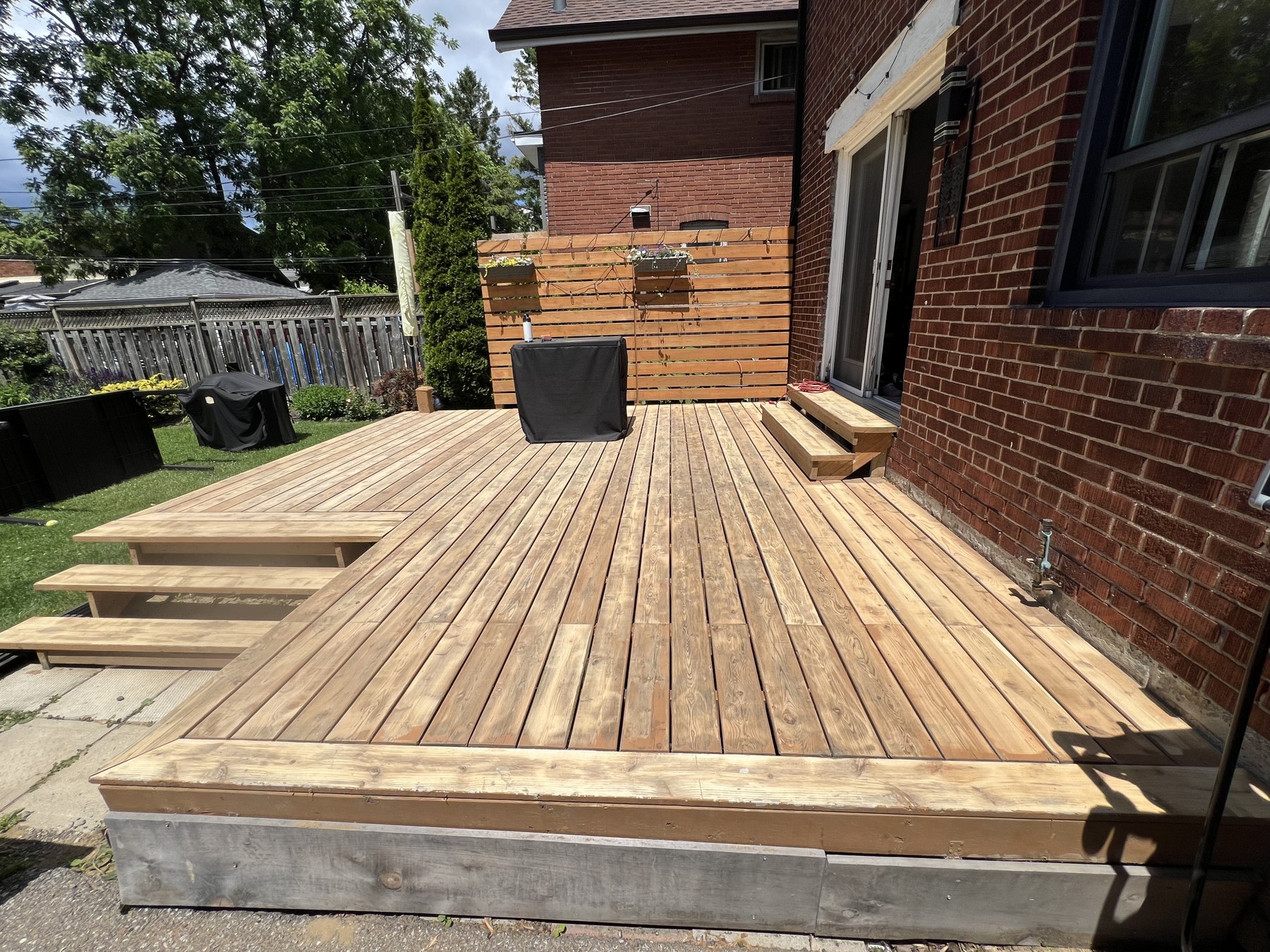 Deck stripped down to bare raw wood mid-process