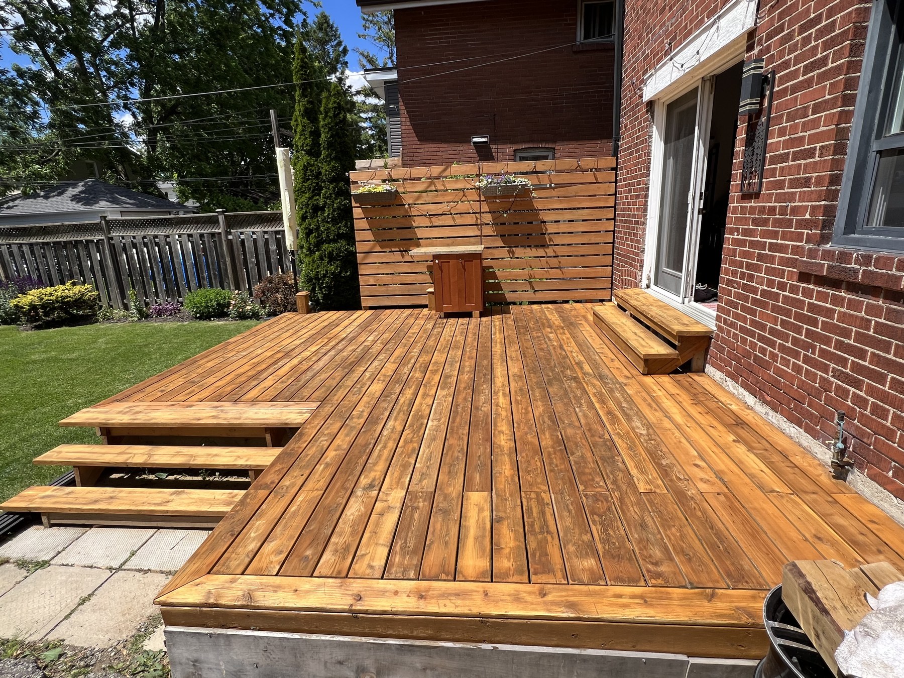 Backyard deck after fresh golden restain